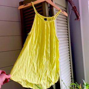 Medium Gap like new tank top, 100% rayon. Light and airy. Bright yellow colour